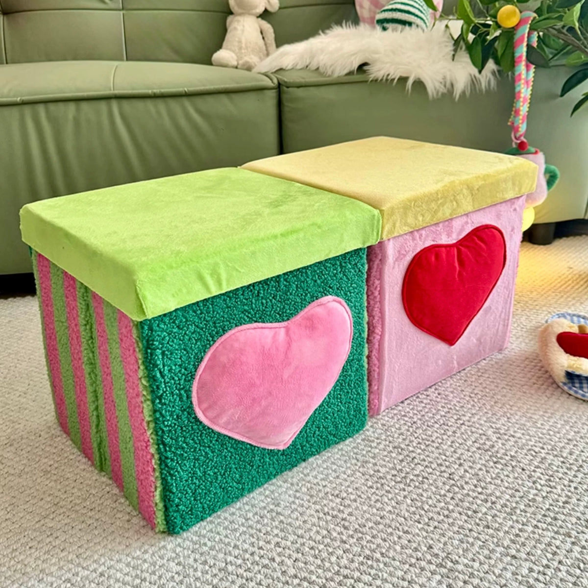 Green and pink storage stools styled side by side