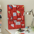 Compact wall-mounted storage rack with hooks and compartments. Great for kitchens, bathrooms, and modern offices.