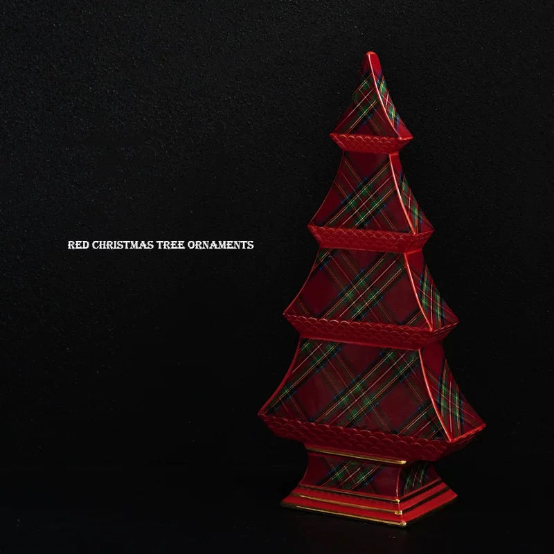 A tartan Christmas tree is shown at an angle, with red tier edges and a stepped pedestal below the plaid panels.