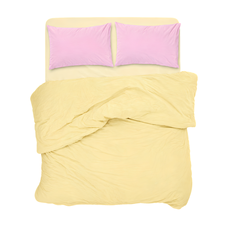 Pastel yellow bedding set with pink pillows