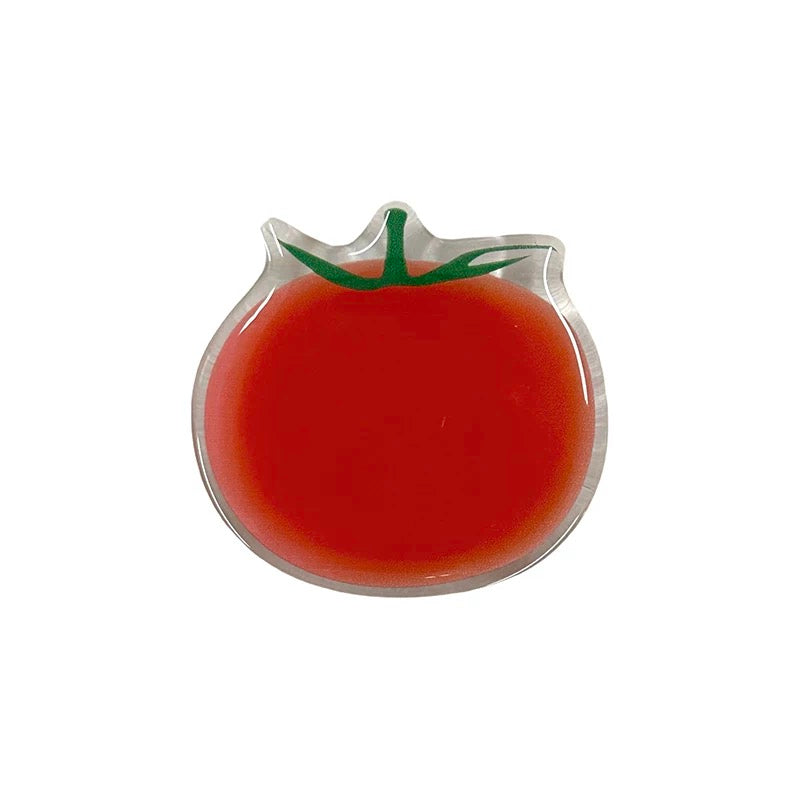 Close-up of 3D tomato GripTok attached to a blue striped phone background.