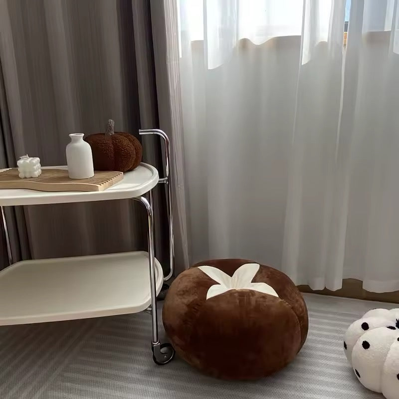 Soft tomato cushion in dorm room setup