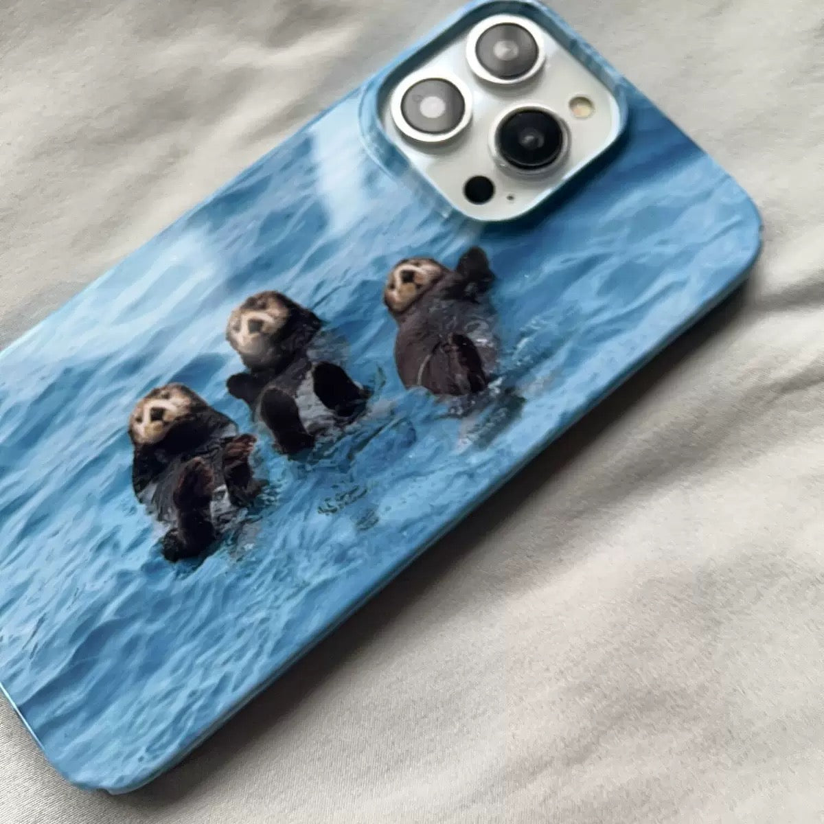 Trendy animal lover iPhone case with blue otters