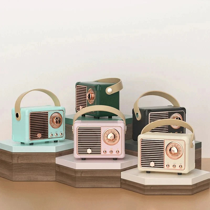 Vintage-style radio with green casing and bronze accents on a white background