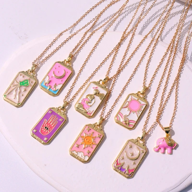 Pink tarot card necklace with intricate detailing, perfect for mystical enthusiasts.