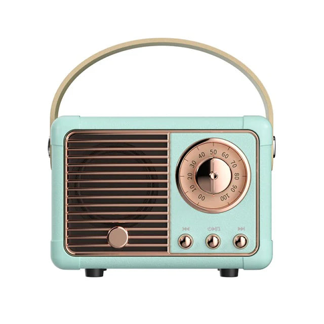 Vintage-style radio with a turquoise body and rose gold accents on a white background