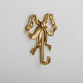 Vintage-inspired brass bow-knot wall hook for coquette decor