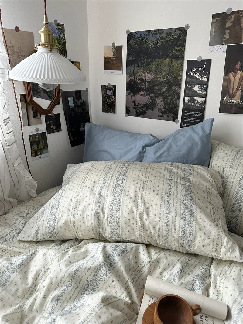 Vintage blue striped cotton duvet cover paired with matching pillowcases for cozy cottage inspired sleep space today.