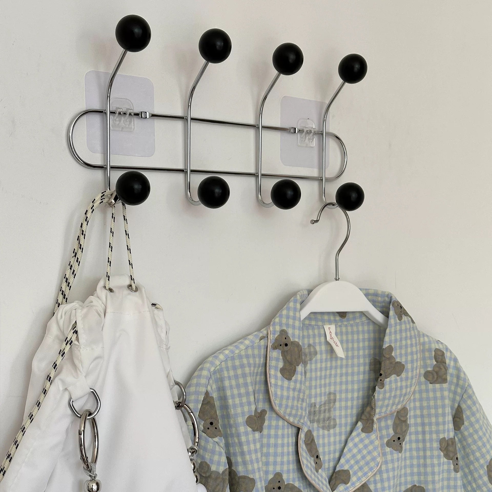 Retro coat rack in pink, perfect for hanging towels and coats