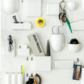 Danish pastel wall-mounted organizer with hooks and shelves. Space-saving storage solution for any room in the house.