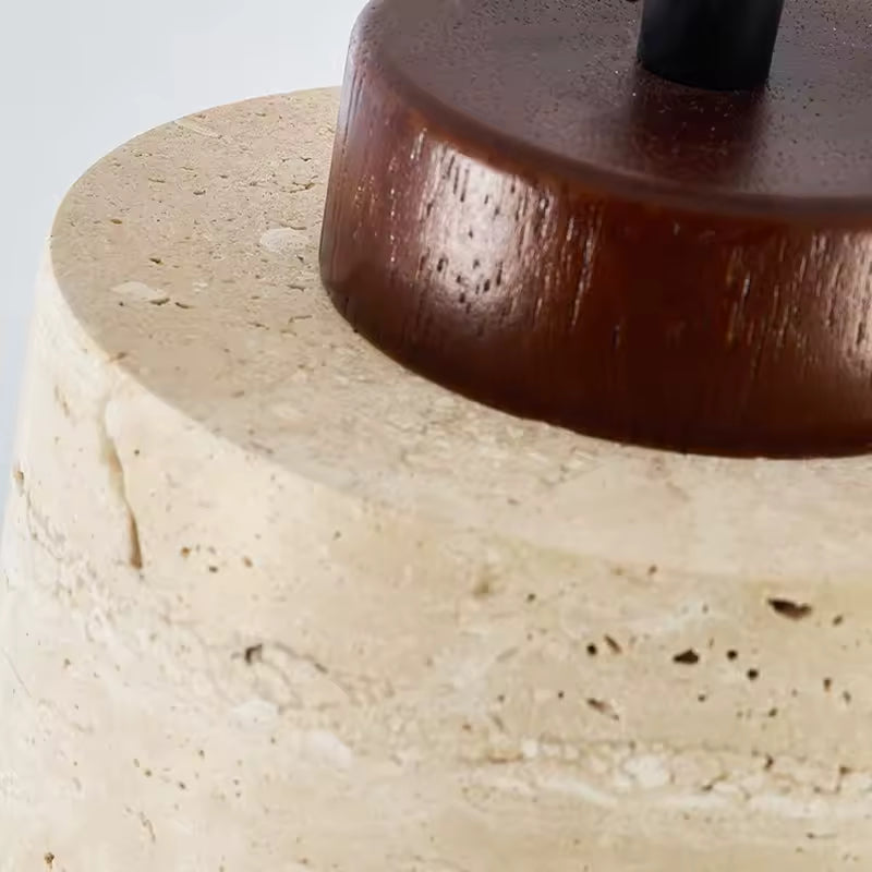 Warm minimalist pendant light with beige stone shade and wood top for cozy home decor.