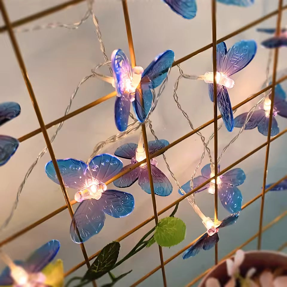 String lights with blue butterfly-shaped lights on a grid background