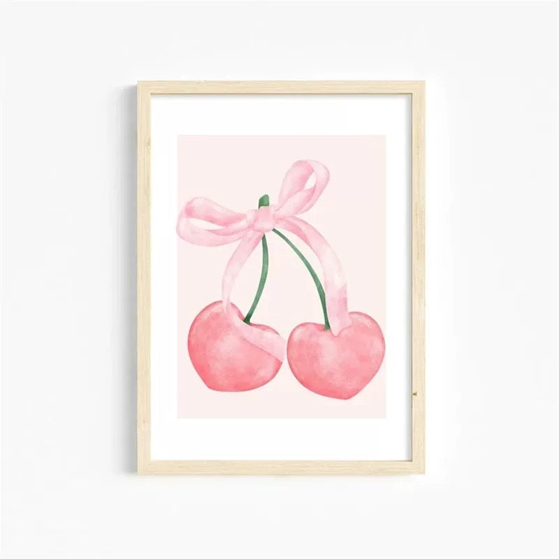 Feminine canvas wall art featuring bows and cherries in soft blush tones.