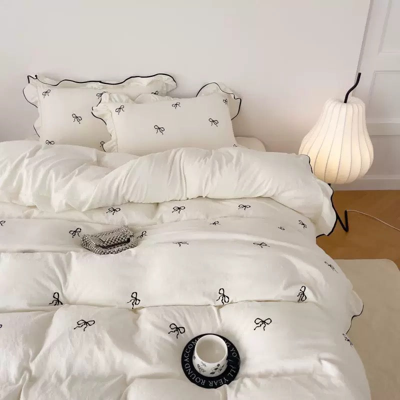 Coquette girl’s bedding set styled with pastel accessories