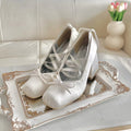 White lace-up ballet-style pumps for retro and modern fashion