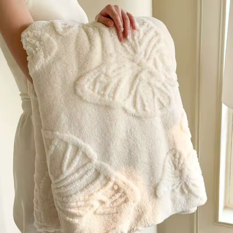 Soft girl style white fleece blanket folded in hand