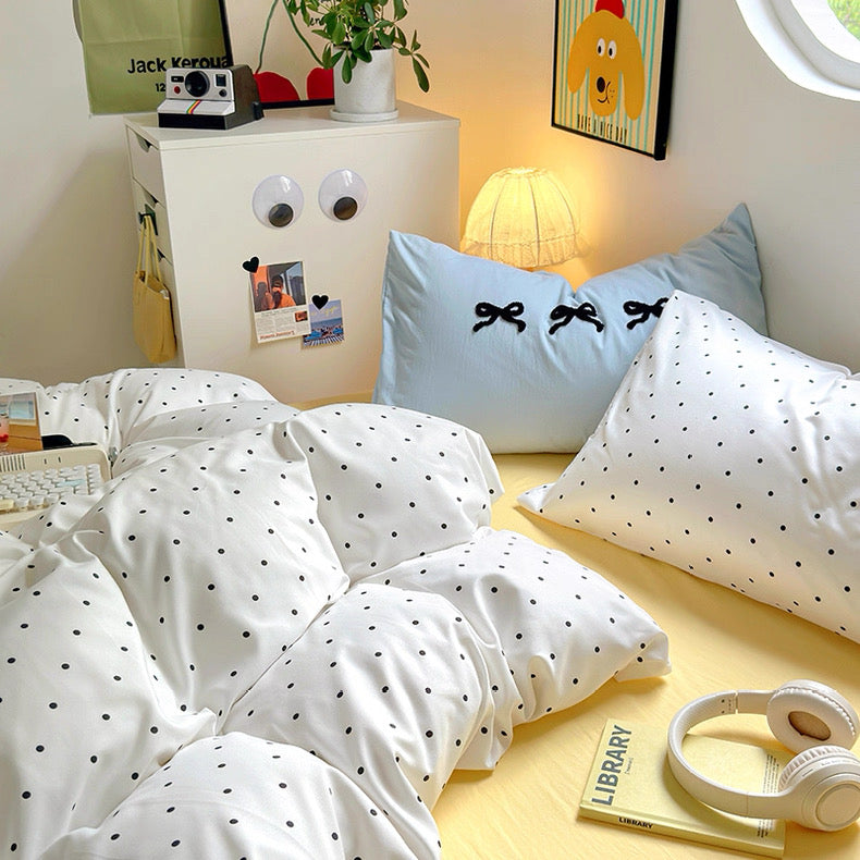 White cotton bedding set with small black polka dots in soft girl dorm