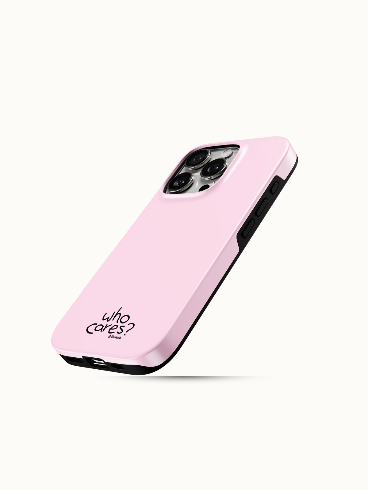 Pastel pink iPhone case with a tiny black who cares print near the bottom, angled view