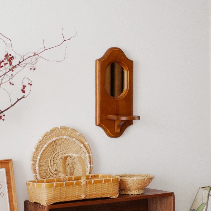 Retro wood mirror with glass reflection and natural texture.