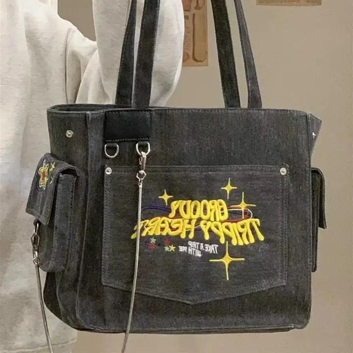 Y2K aesthetic gray bag with embroidered lettering design