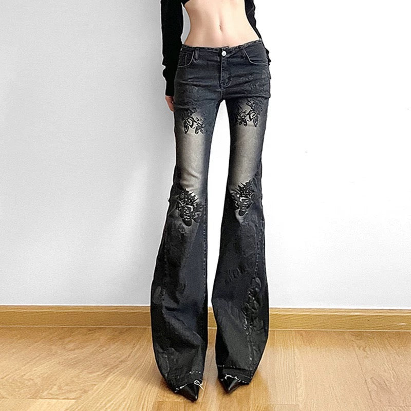 Subculture style Y2K denim pants with a bold floral pattern and distressed look