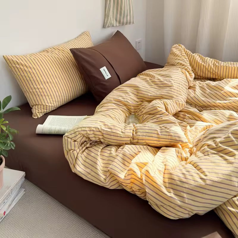 Soft breathable cotton bedding in yellow stripe pattern for aesthetic home.