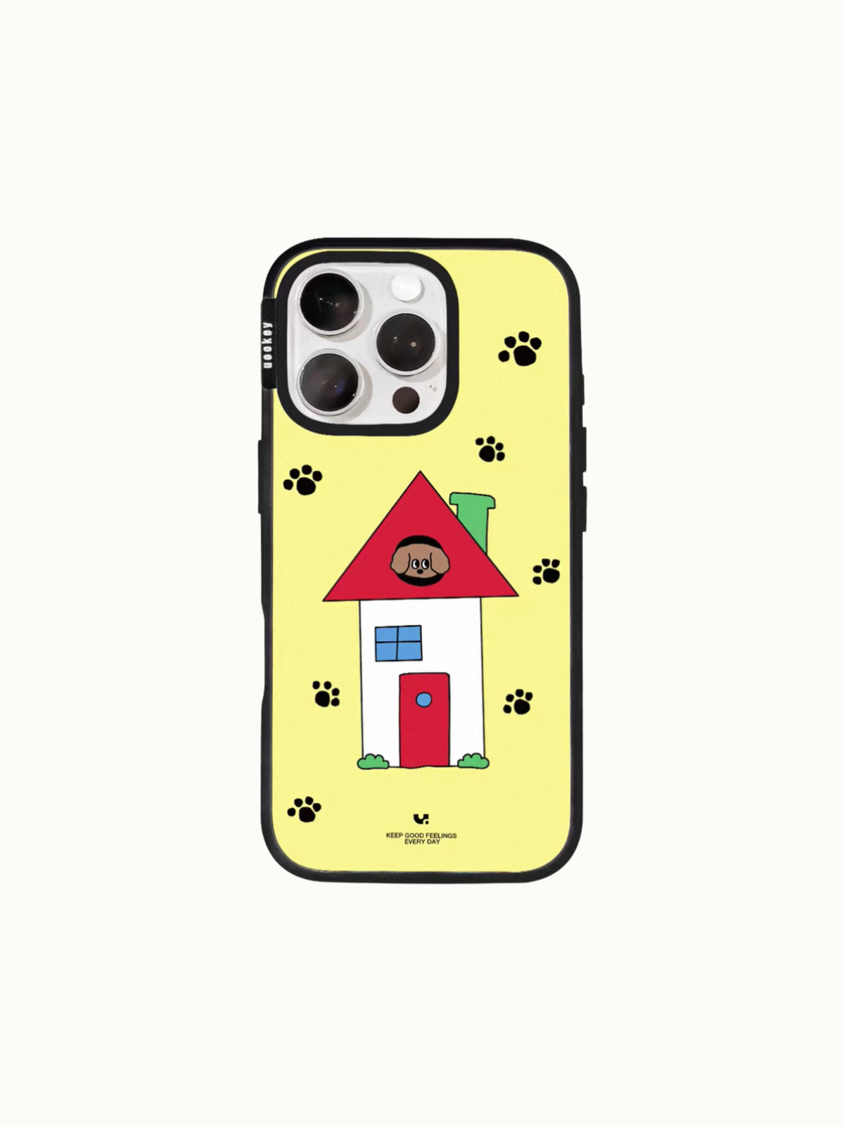 A yellow dog house phone case shows a puppy in a red roof window, with scattered black paw prints.